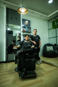 Barbershop in Cuenca, Ecuador with stylists and modern interior design.